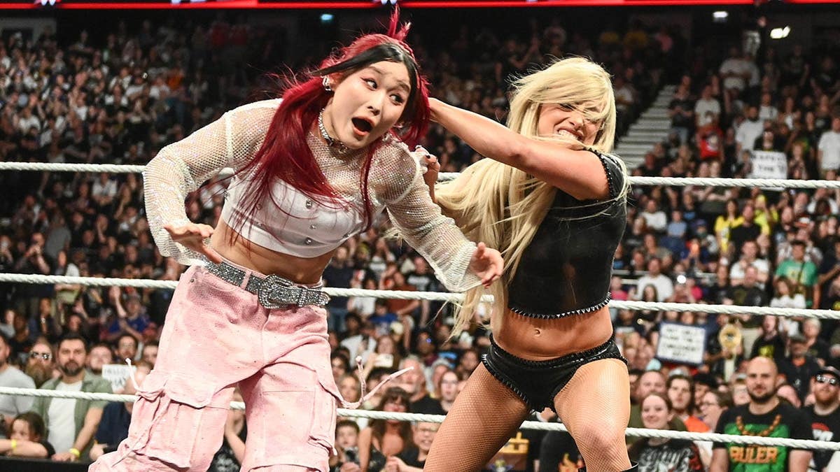 Liv Morgan and Iyo Sky wrestling in a ring at The O2 Arena in London