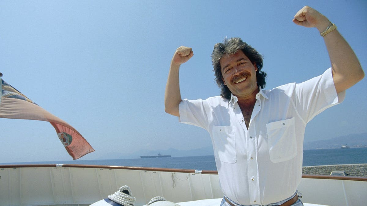 Mario Kasser standing on a boat in Cannes.