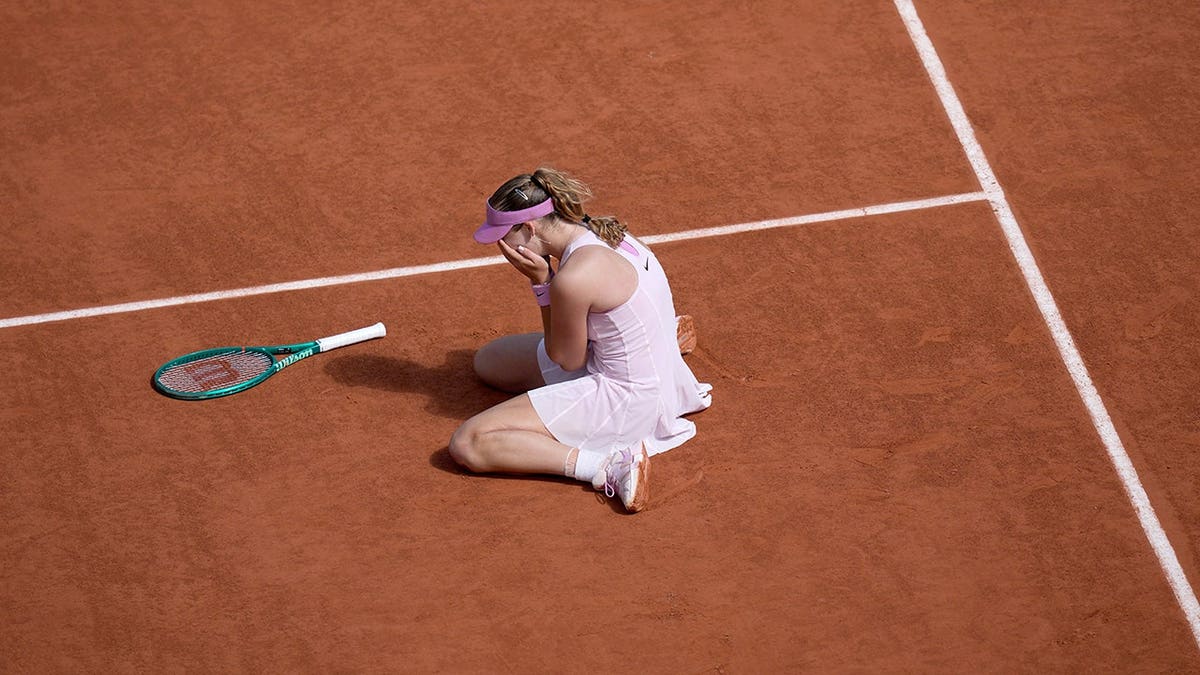 Mirra Andreeva celebrating after winning women's tennis final match