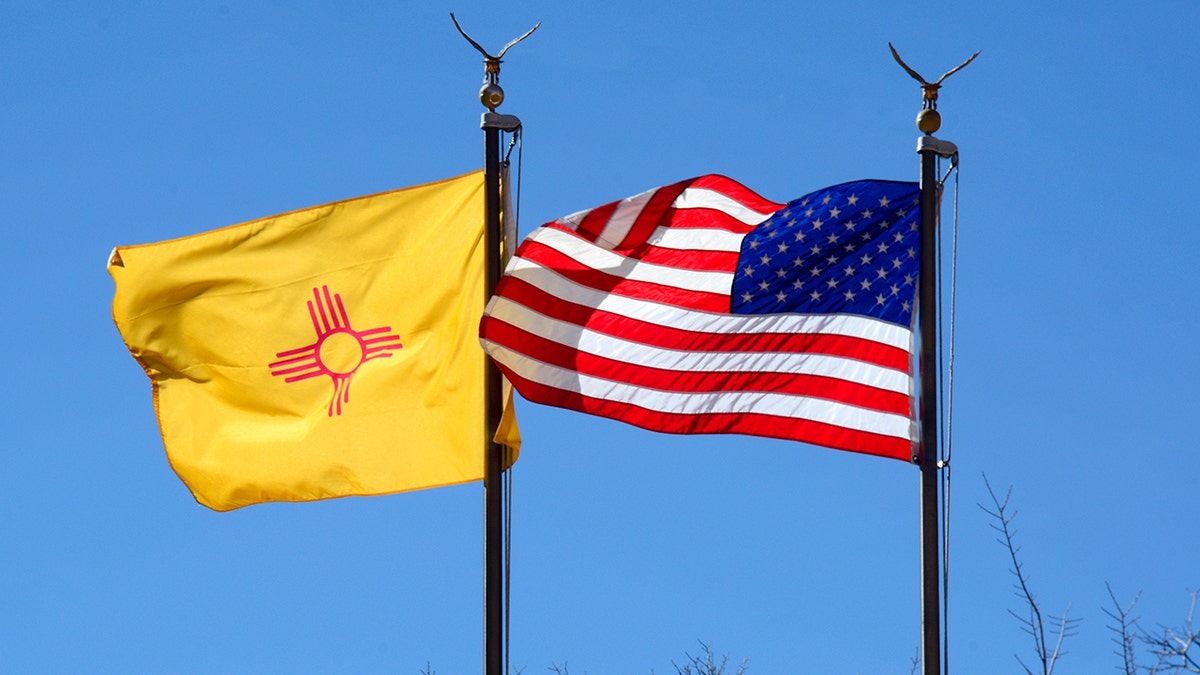 New Mexico and American flags flying side by side at the New Mexico Museum of Art in Santa Fe