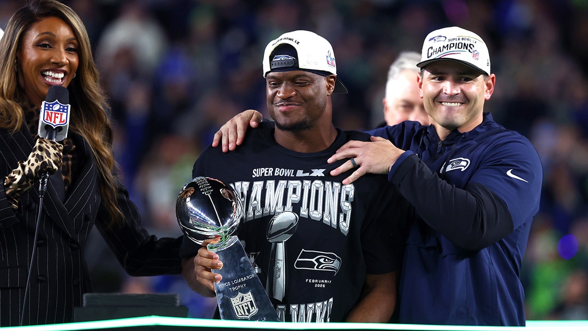 Seattle Seahawks head coach Mike Macdonald and running back Kenneth Walker III holding Vince Lombardi trophy at Levi's Stadium