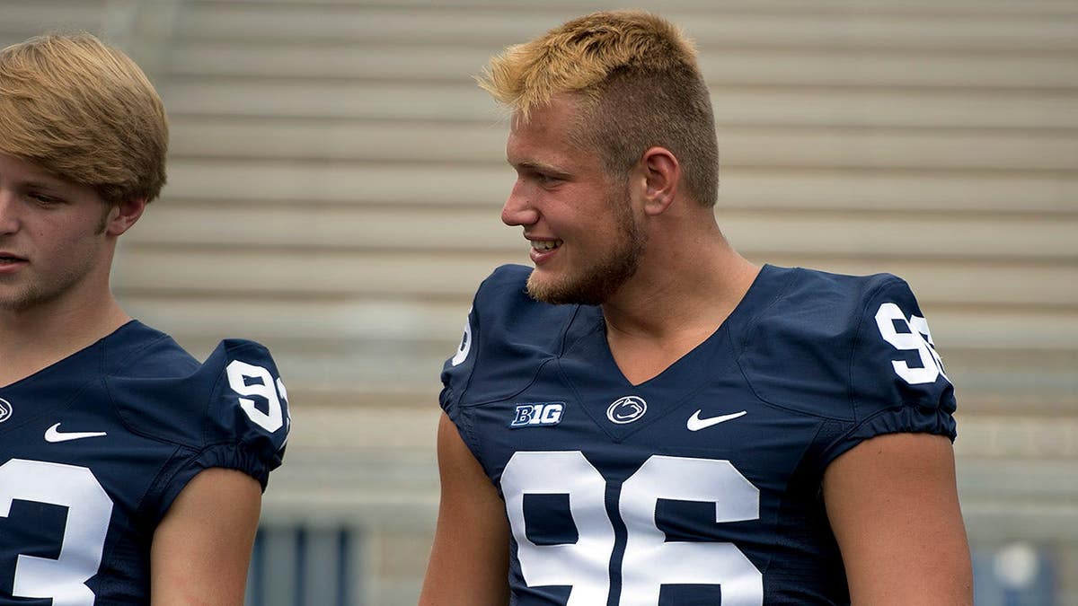 Penn State punter Blake Gillikin and snapper Kyle Vasey standing on the sideline at Beaver Stadium.