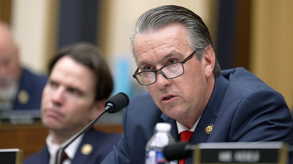 Rep. Barry Moore in front of microphone
