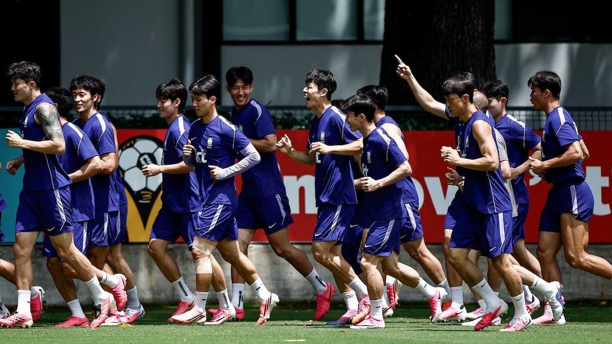 South Korea players training on a grass field at Chivas Verde Valle in Guadalajara