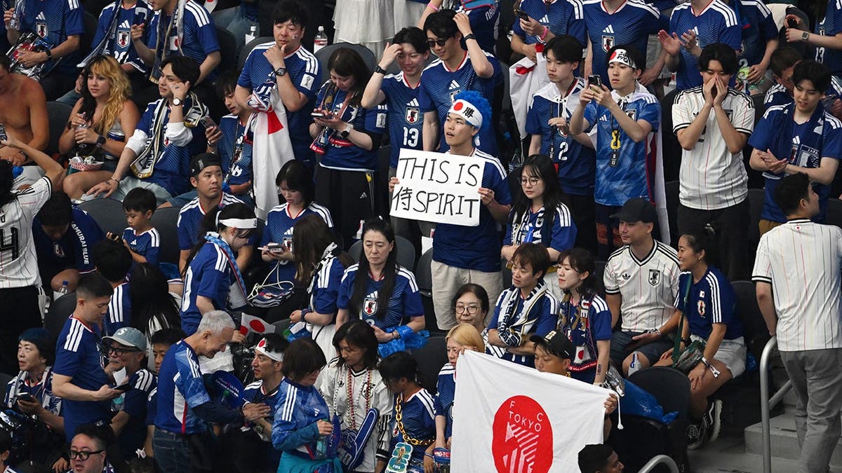 Japan fans watching the World Cup Group F soccer match in Arlington, Texas