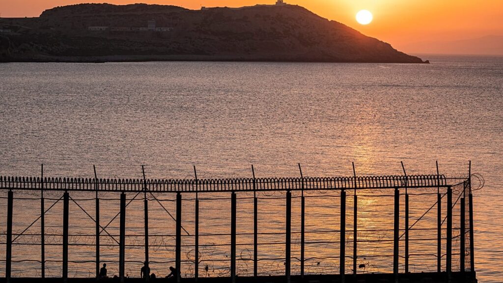 Hundreds of migrants swim from Morocco to Spanish territory Hundreds of migrants swim from Morocco to Spanish territory