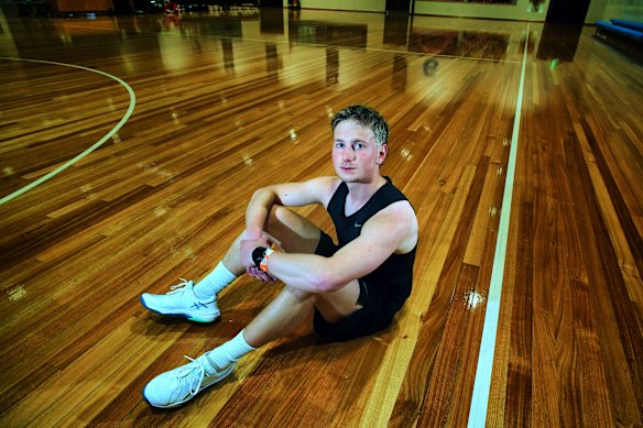 Anthony Audino rests after winning his round of the gruelling beep test.