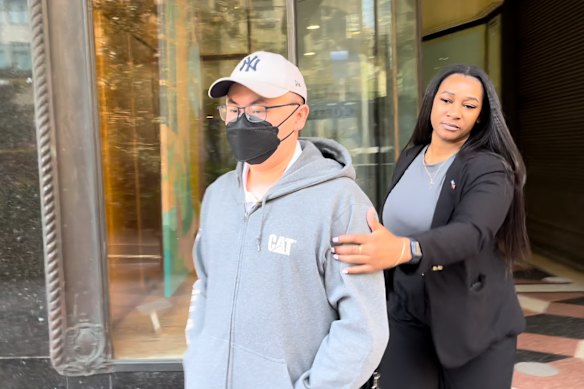 Surya Subekti (left) outside Downing Centre Local Court in Sydney in 2024.