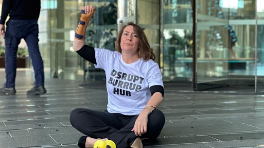 Disrupt Burrup Hub protester Kristen Morrissey outside Woodside’s headquarters on June 1.