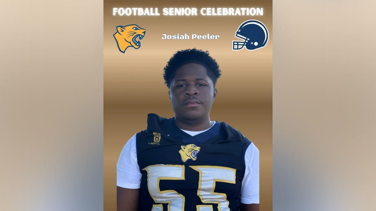 Josiah Peeler in a black and gold Cheltenham football jersey numbered 55, pictured in a
