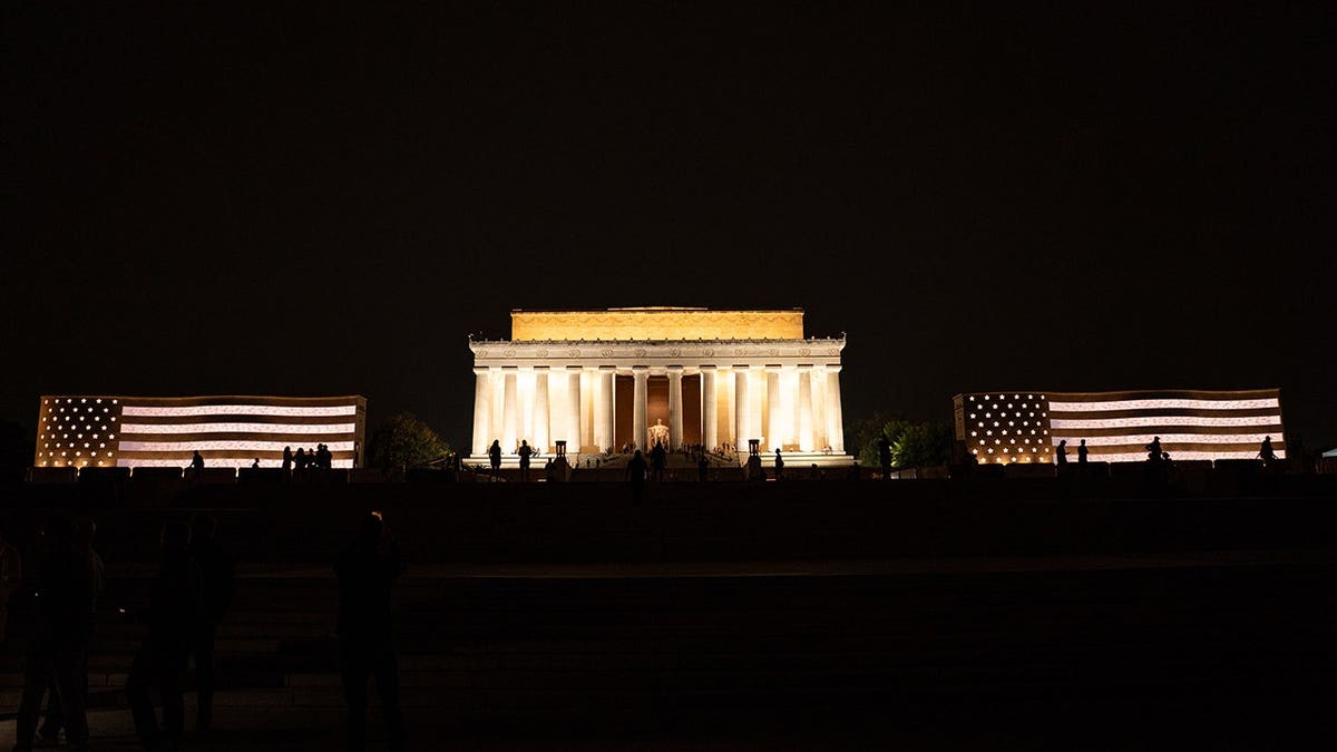 National Military Monument illuminated near the Lincoln Memorial in Washington, D.C.