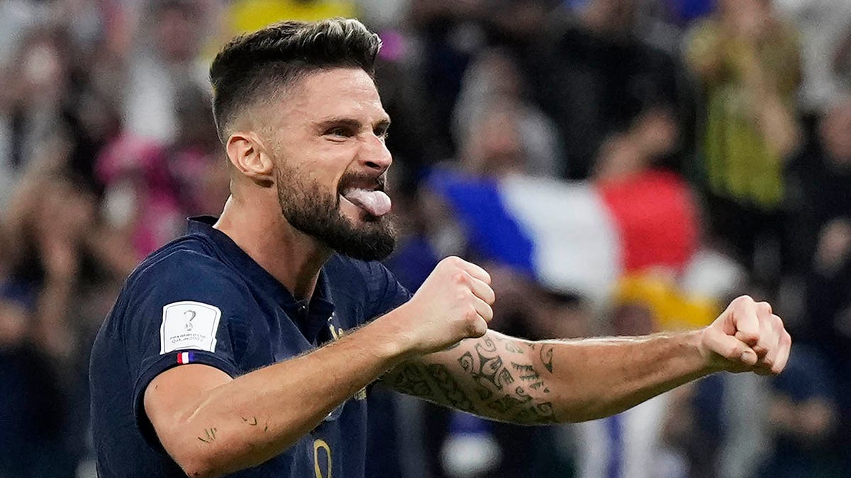 Olivier Giroud celebrates Kylian Mbappe's goal