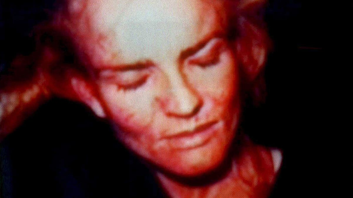 Nicole Brown Simpson photo appears on a television screen.