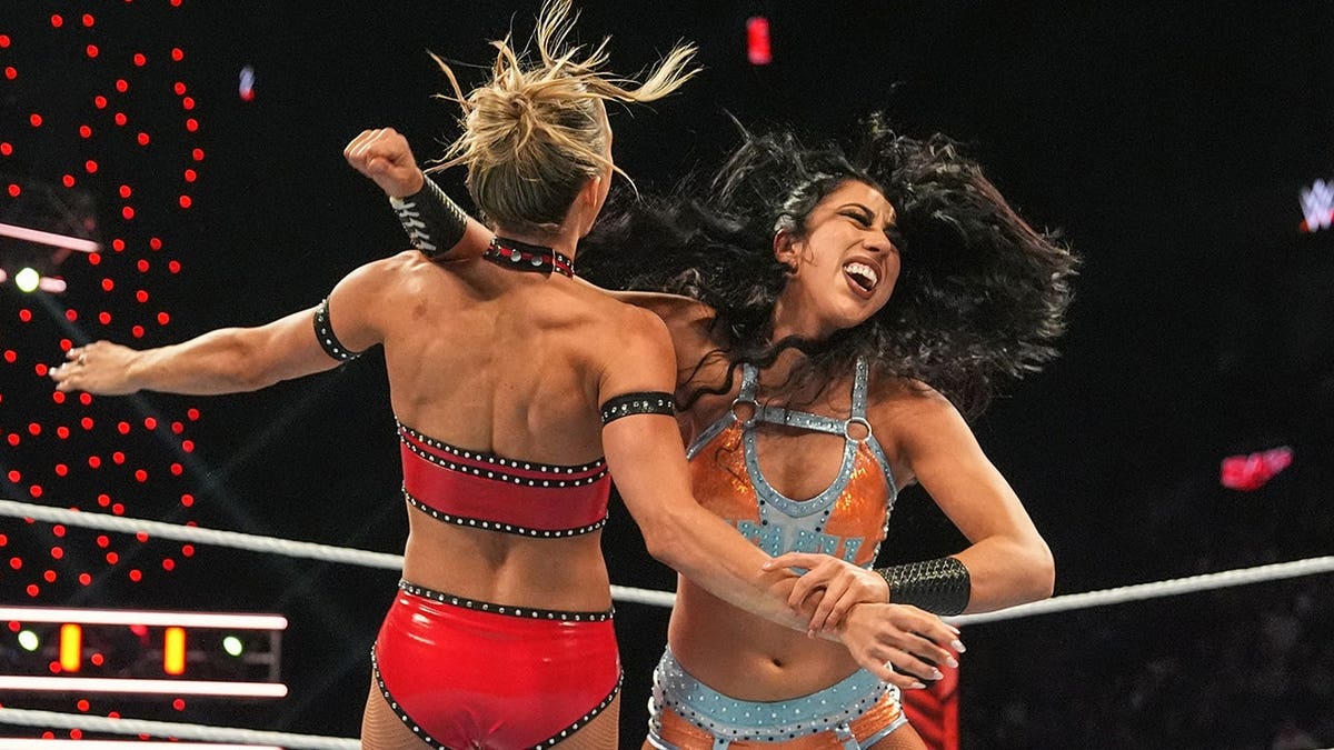 Indi Hartwell clotheslines Maxine Duper during Monday Night RAW at the Bell Centre in Montreal.