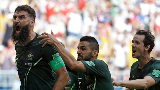 Mile Jedinak celebrates a goal for Australia.