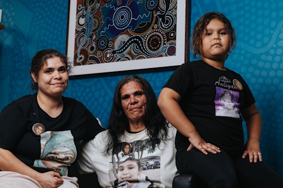 Amanda Hall (centre), her daughter  Alinta Russell (left) and granddaughter Mirabella Slater-Russell (right) pay tribute to Aaliyah with commemorative shirts.