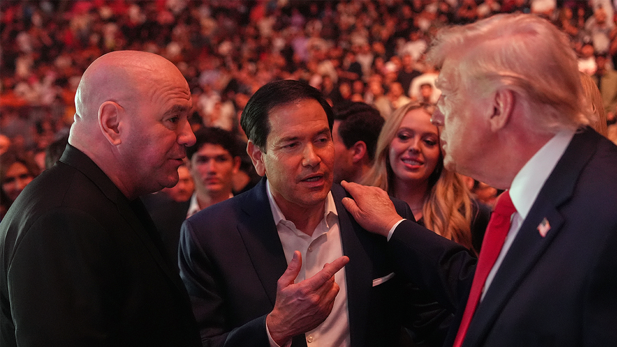 President Trump speaks with Secretary of State Marco Rubio and UFC CEO Dana White at UFC 327 in Miami.