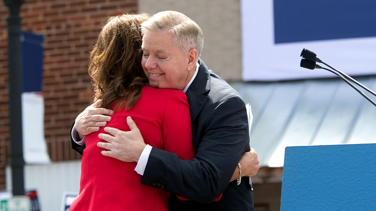 Sen. Lindsey Graham (R-SC) hugs his sister Darline Graham Nordone