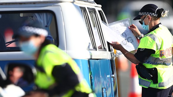 Queensland police officers patrol the state’s border with NSW during the COVID pandemic in 2021.