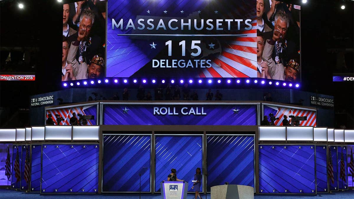 A large screen displays the Massachusetts delegation during the Democratic National Convention roll call in Philadelphia