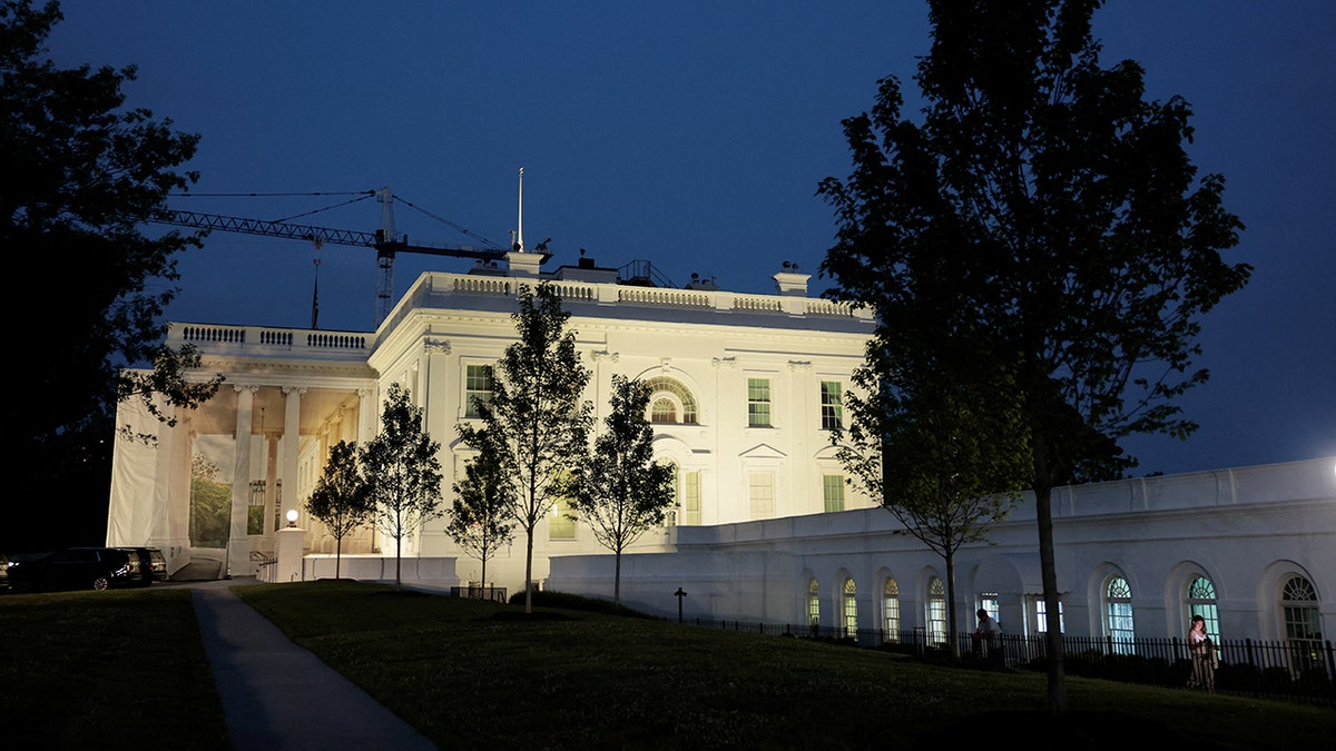 The White House seen lit at night.