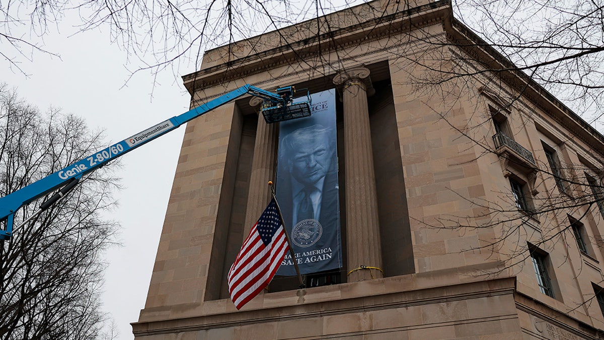 A banner of U.S. President Donald Trump hanging on the Department of Justice building.