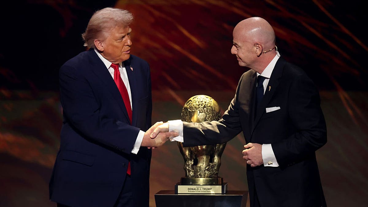 president donald trump shakes hands with fifa president gianni infantino