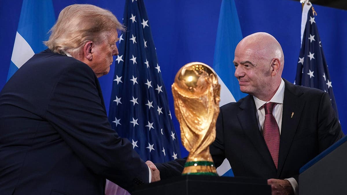 Donald Trump shakes hands with Gianni Infantino at Trump Tower.