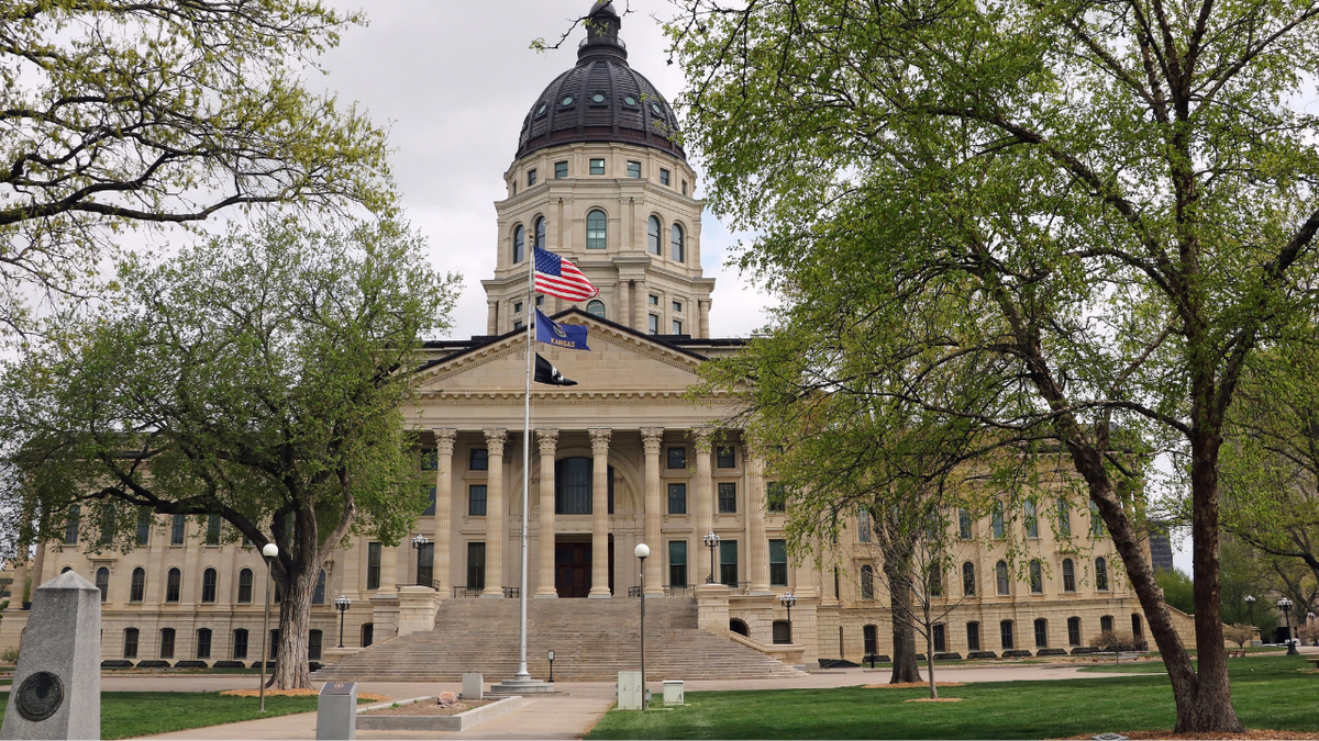 The Kansas state capital is in central Topeka, Kansas and is surrounded by over 20 acres of parklike grounds.