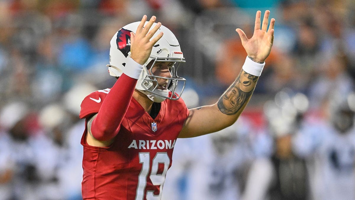 Carson Beck celebrates after throwing a touchdown pass