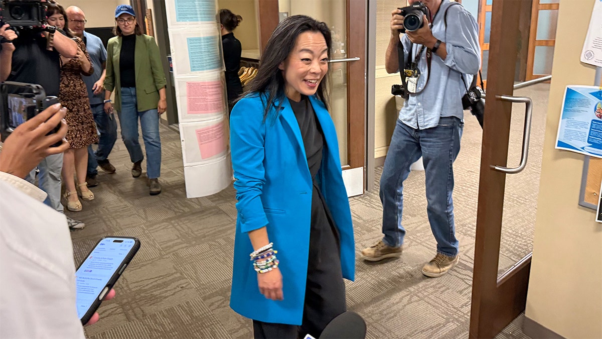 Francesca Hong arrives to vote in Wisconsin's primary