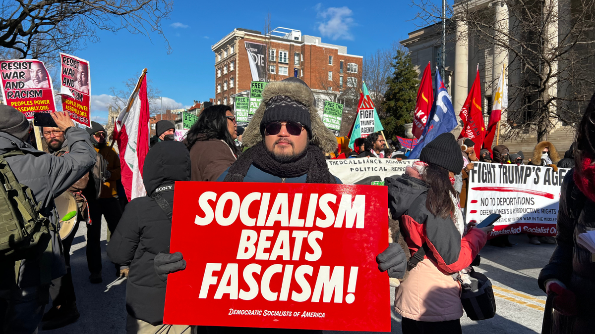 In an anti-Trump march, Democratic Socialists of America members carried signs against