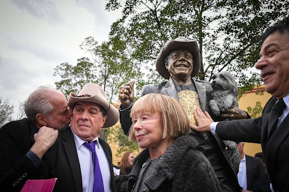 Carr (right) at the unveiling of a statue for Molly Meldrum alongside Michael Gudinski, Meldrum and Jeanne Pratt.