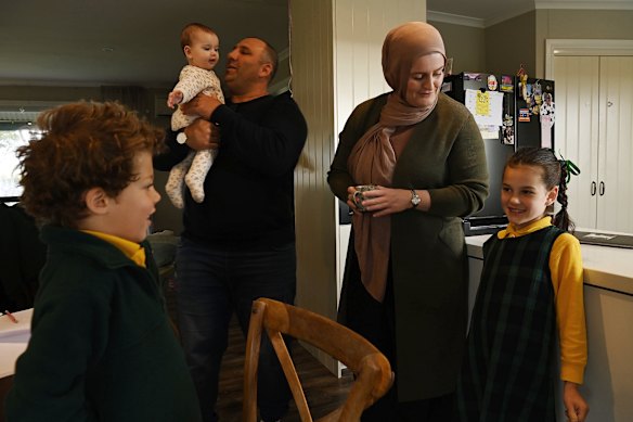 Omar Kowaider and wife Joanne with children Hakeem (left), Hannah and Layla as they get ready for the school day. 