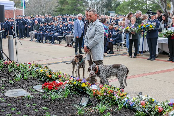 Thompson’s best friend Dirk Wendt brings his own dog Beau, brother  of Thompson’s beloved late dog Jimmy, and Jimmy’s daughter dog Ivy, to visit the new memorial.