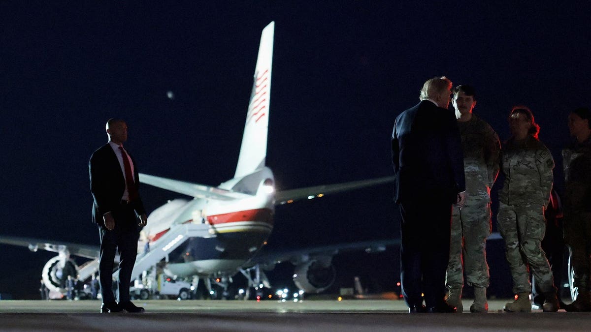 Donald Trump greets security forces members at RAF Mildenhall.