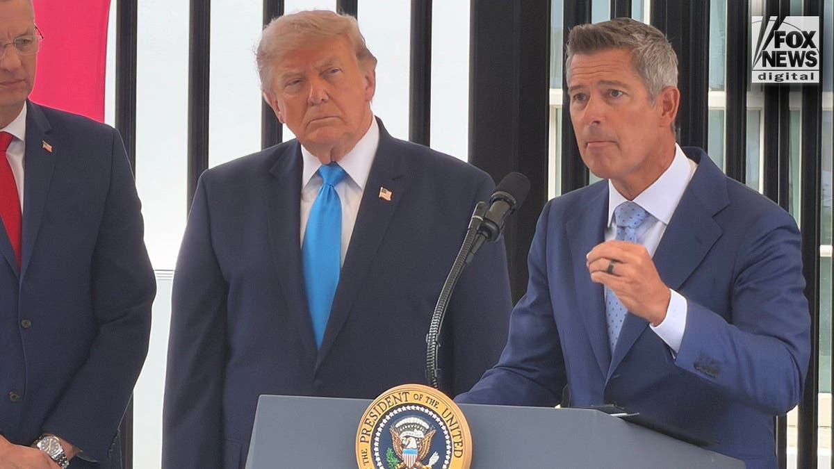 Transportation Secretary Sean Duffy speaks as President Donald Trump looks on during the Freedom Haulers announcement.