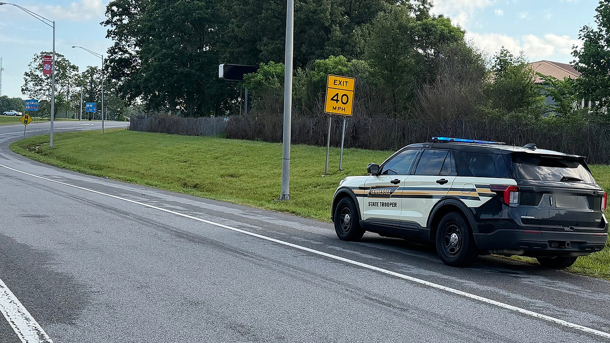 Tennessee Highway Patrol cruiser parked on the shoulder