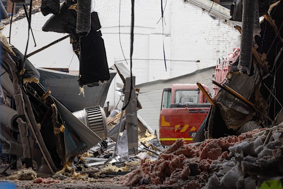 The view of the collapsed roof from inside the building.