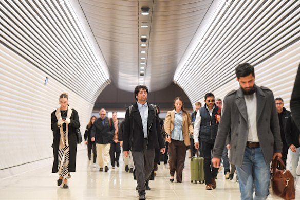 Passengers file through Gadigal station during the morning peak.