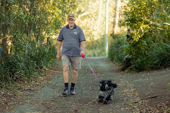 Ron Daniel walks his cocker spaniel Tilly.