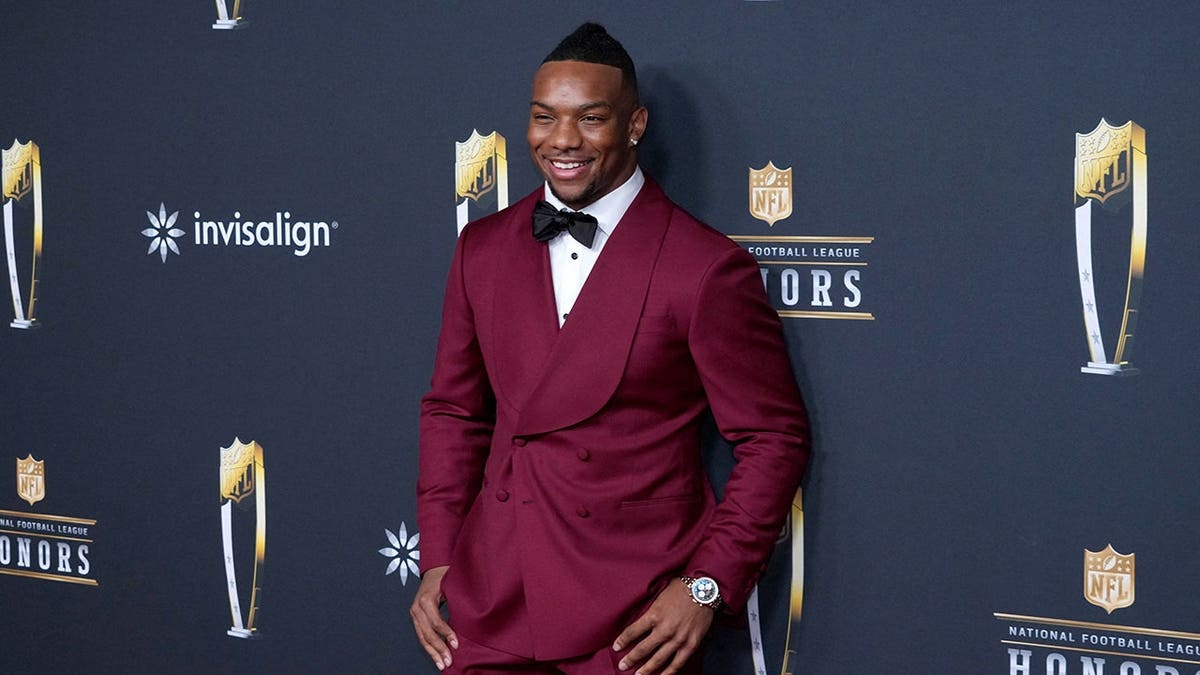 Bijan Robinson poses on the red carpet at the NFL Honors event.