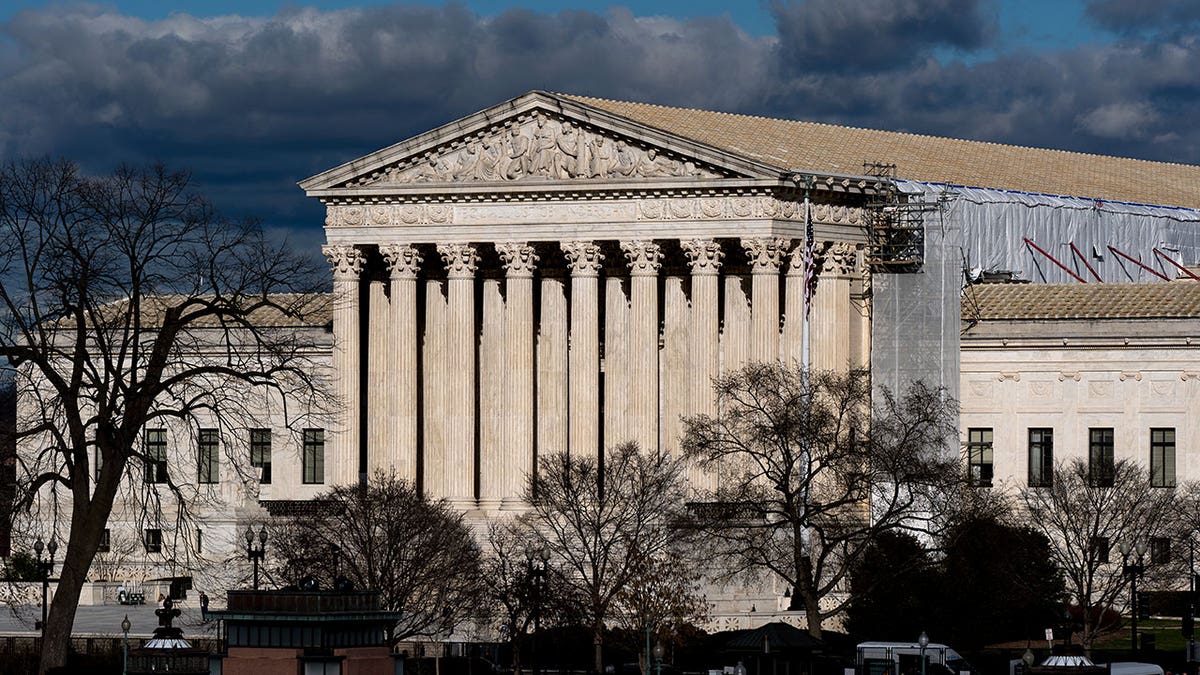 Supreme Court with clouds in the background