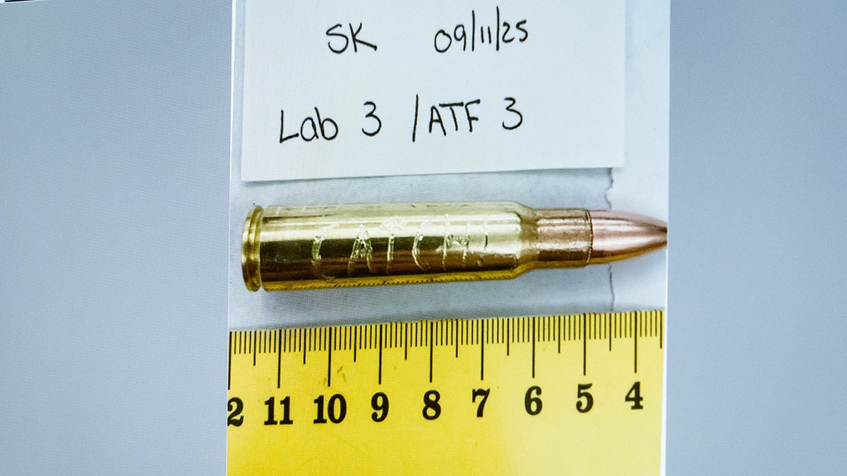 An image of a bullet casing engraved with the word 