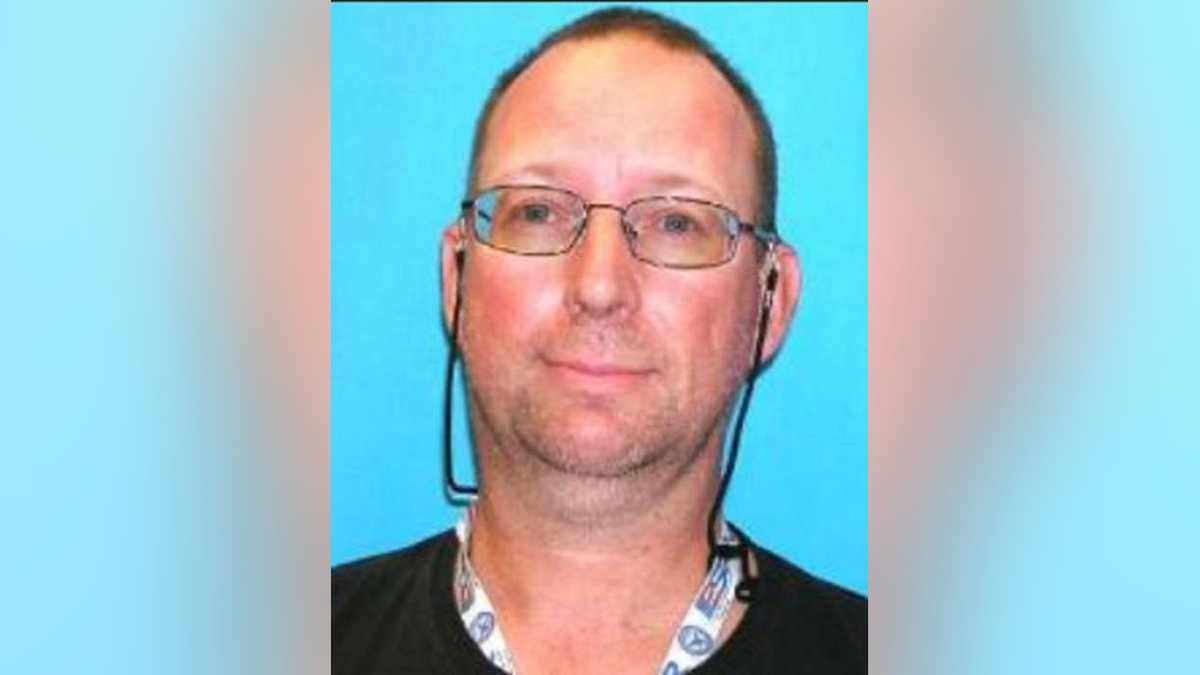 Donald Steven Lang in an FBI photograph against a blue background