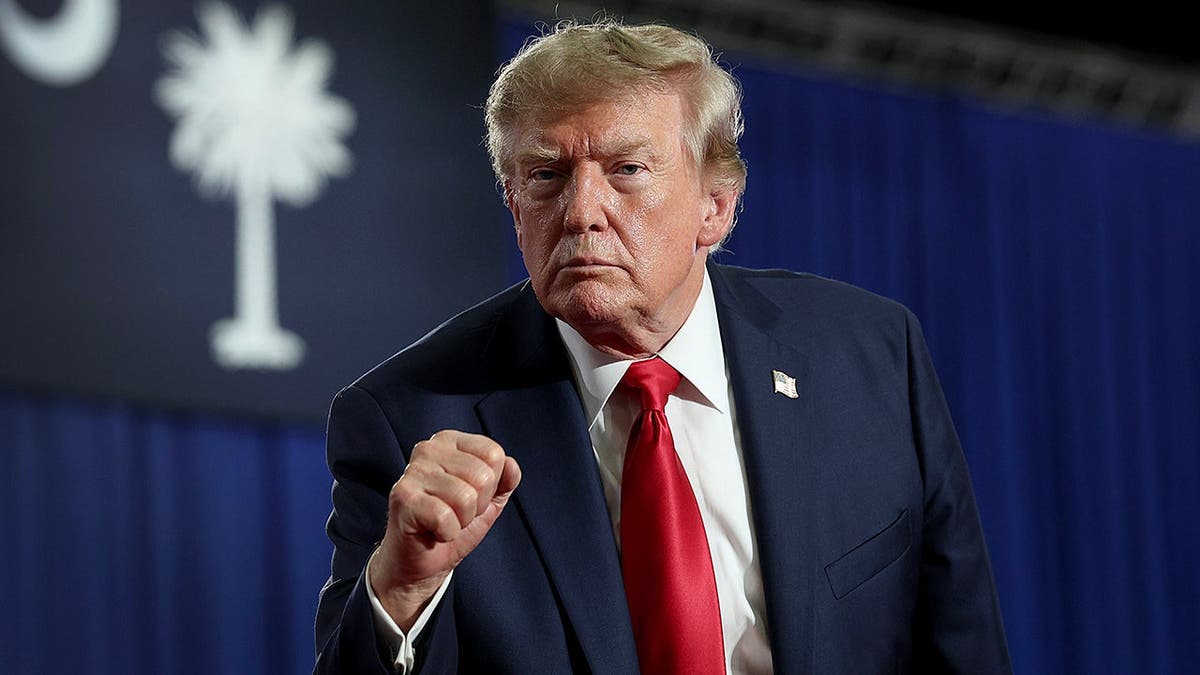 Donald Trump leaves the stage after speaking at a campaign rally in Myrtle Beach, S.C.