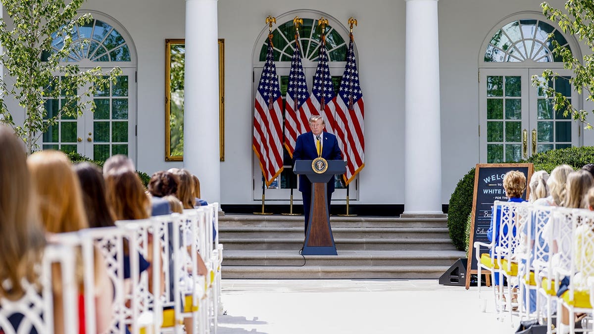 Donald Trump stands during an event in the White House Rose Garden.
