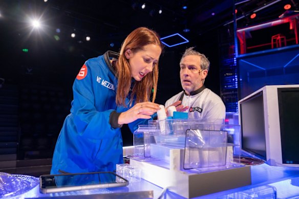 Lollback plays a geneticist on board a Mars mission. Standish plays her doofus boyfriend.