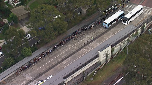 Commuters endure long queues for replacement buses at Gordon on Tuesday morning.