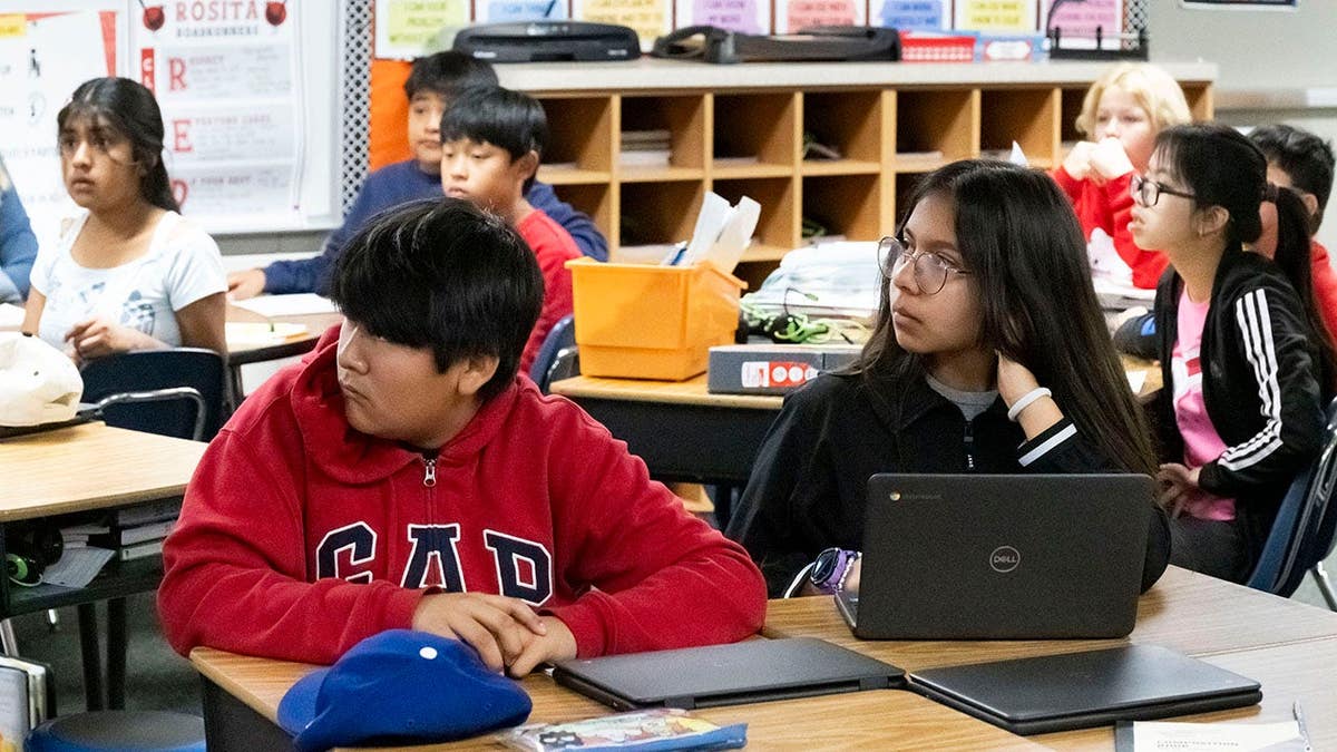 Students listen to Gabriela Mafi at Rosita Elementary School.